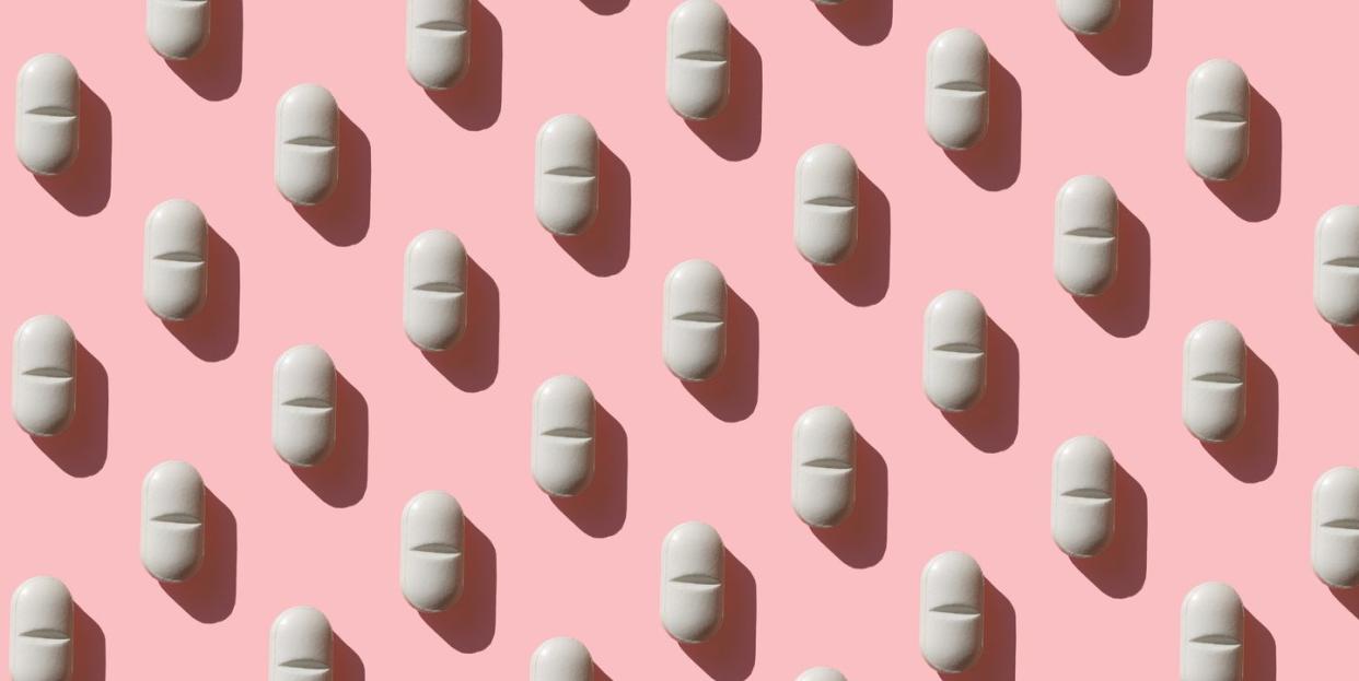 repeated pills on pink background