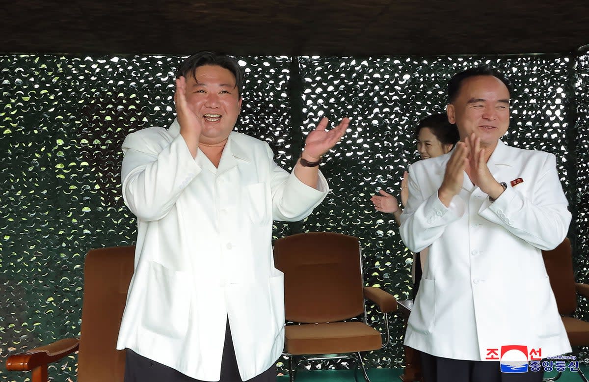 North Korea's leader Kim Jong-un applauding the test firing of a new intercontinental ballistic missile (ICBM) ‘Hwasong-18’ at an undisclosed location in North Korea  (KCNA VIA KNS/AFP via Getty Image)
