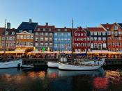 Colorful 17th- and 18th-century townhouses line the waterfront of the Nyhavn area of Copenhagen. The scenic spot was once home to Hans Christian Anderson, who lived at Nyhavn 18, and the area is full of restaurants and bars with outdoor seating for patrons to enjoy a canal-side meal during the warmer months.