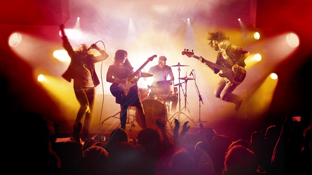  Rock Band 4 header image - four-person band on stage in front of a crowd. 