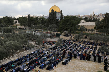 Palestinian Muslims attend Friday prayers close to the Golden Gate near Al-Aqsa mosque in Jerusalem's Old City February 22, 2019. REUTERS/Ammar Awad