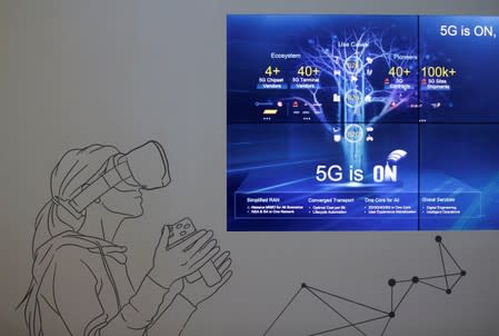 FILE PHOTO: A screen is seen in a showroom of 5G technology in Huawei's headquarters in Shenzhen