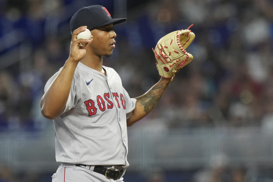 Boston Red Sox starting pitcher Brayan Bello reacts after he was charged with a balk during the first inning of a baseball game against the Miami Marlins, Wednesday, July 3, 2024, in Miami. (AP Photo/Marta Lavandier)