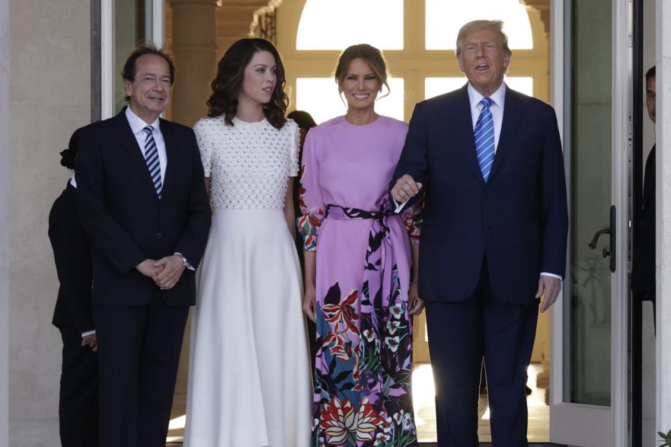 Donald and Melania Trump at the home of John Paulson with Alina de Almeida in Palm Beach, Florida. 