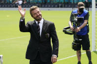 David Beckham, owner and president of soccer operations for Inter Miami, waves to fans before an MLS soccer match between Inter Miami, and LA Galaxy, Sunday, April 18, 2021, in Fort Lauderdale, Fla. (AP Photo/Lynne Sladky)