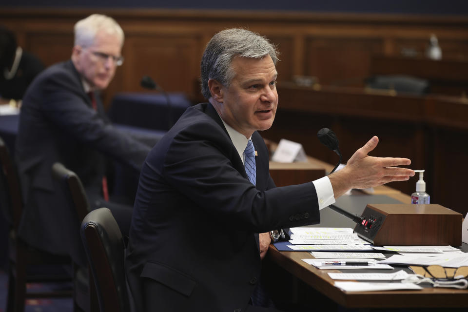 FBI Director Christopher Wray testifies before a House Committee on Homeland Security hearing Thursday, Sept. 17, 2020, on Capitol Hill Washington. National Counterterrorism Center Director Christopher Miller is left. (Chip Somodevilla/Pool via AP)