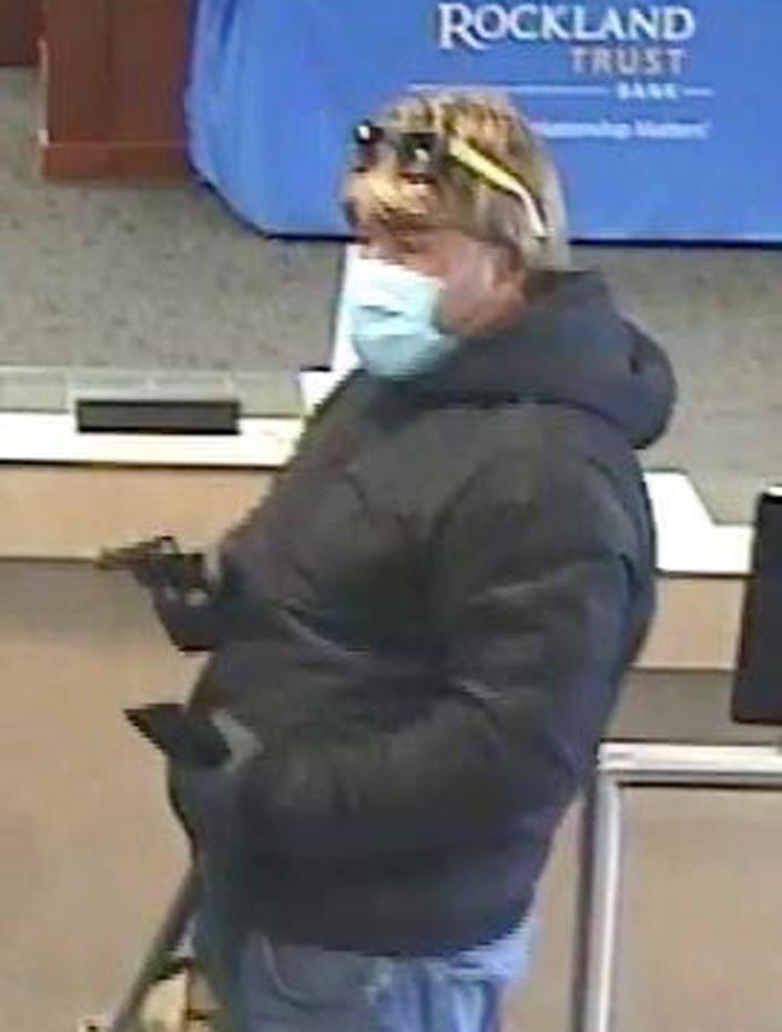 Falmouth Police released this surveillance photo of the bank robber holding a hand gun at the Rockland Trust Bank on Davis Straits in Falmouth as it was robbed on Saturday morning around 9 a.m.