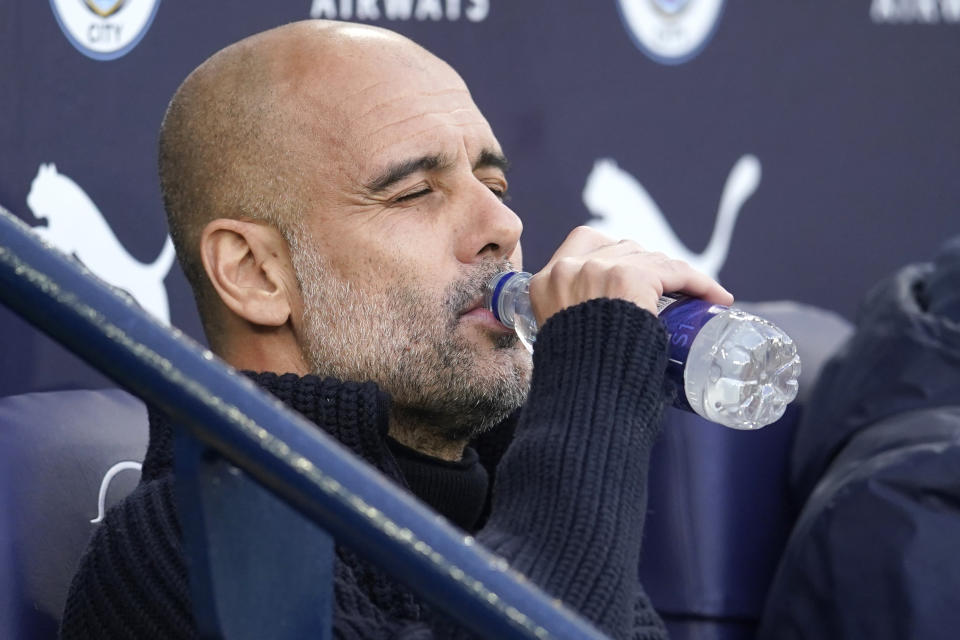 Manchester City's head coach Pep Guardiola drinks a water ahead the English Premier League soccer match between Manchester City and West Ham United at Etihad stadium in Manchester, England, Wednesday, May 3, 2023. (AP Photo/Dave Thompson)