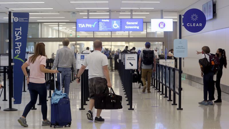 Travelers make their way through the Transportation Security Administration checkpoint at the new Salt Lake City International Airport in Tuesday, Sept. 22, 2020. Over 148 million American adults are planning to travel for Labor Day this year, according to a survey.