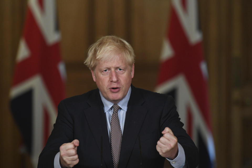 Britain's Prime Minister Boris Johnson speaks during a virtual press conference at Downing Street, London, Wednesday Sept. 9, 2020, following the announcement that the legal limit on social gatherings is set to be reduced from 30 people to six. The change in England will come into force on Monday as the Government seeks to curb the rise in coronavirus cases. (Stefan Rousseau/Pool via AP)