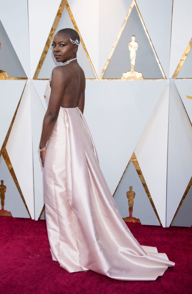 <p>The <em>Black Panther </em>star looked poised and powerful in a backless Gabriela Hearst gown in a pretty blush shade with an elegant train. Perhaps even more eye-catching was the work by Gurira's hairstylist Vernon Scott, <a href="https://www.refinery29.com/en-us/2018/03/192518/danai-gurira-oscars-hairstyle-meaning" rel="nofollow noopener" target="_blank" data-ylk="slk:inspired by ancestral tribal African design;elm:context_link;itc:0;sec:content-canvas" class="link ">inspired by ancestral tribal African design</a>. </p>