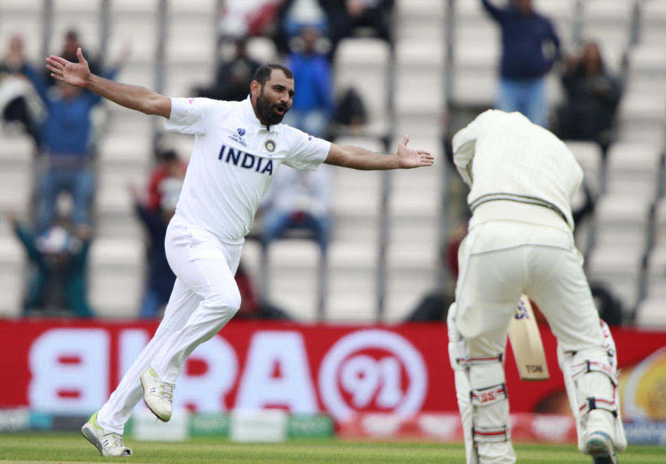 India's Mohammed Shami, left, celebrates the dismissal of New Zealand's BJ Watling, right, during the fifth day of the World Test Championship final cricket match between New Zealand and India, at the Rose Bowl in Southampton, England, Tuesday, June 22, 2021. (AP Photo/Ian Walton)