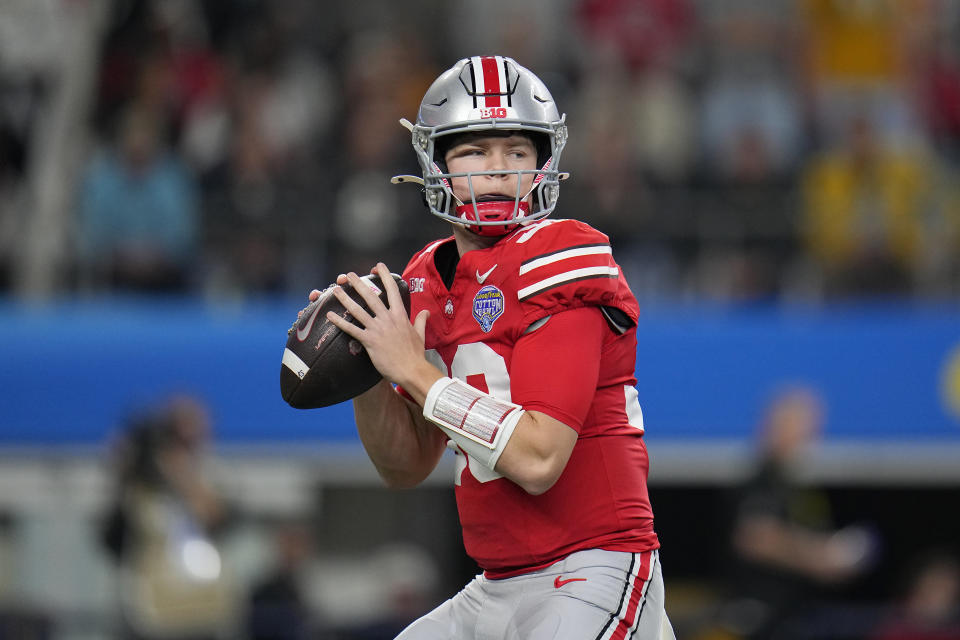 FILE - Ohio State quarterback Devin Brown passes against Missouri during the first half of the Cotton Bowl NCAA college football game Friday, Dec. 29, 2023, in Arlington, Texas. Will Howard and Brown are among five player seeking the starting quarterback role at Ohio State as spring practice opened Tuesday, March 5, 2024. (AP Photo/Julio Cortez, File)