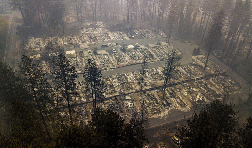 Residences leveled by the wildfire line a neighborhood in Paradise, Calif., on Nov. 15. (Photo: Noah Berger/AP)