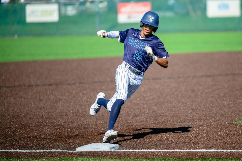 Father Tolton's Cameron Lee (15) rounds 3rd to score the first 'Blazers run of the game in Tolton's 6-3 win over Elsberry in the Class 3 MSHSAA state quarterfinals at Rock Bridge High School on May 27, 2022.