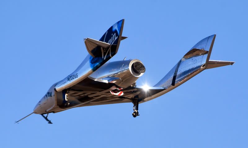 FILE PHOTO: Virgin Galactic’s space tourism rocket plane SpaceShipTwo returns after a test flight from Mojave Air and Space Port in Mojave