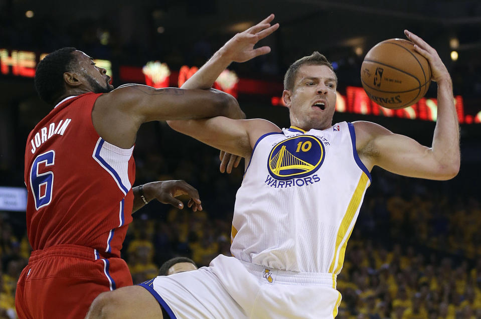 Golden State Warriors power forward David Lee (10) grabs the ball next to Los Angeles Clippers center DeAndre Jordan (6) during the first quarter of Game 6 of an opening-round NBA basketball playoff series in Oakland, Calif., Thursday, May 1, 2014. (AP Photo/Marcio Jose Sanchez)