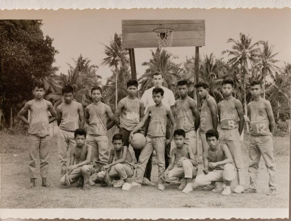 Shrewsbury resident Donald Yates, rear center, helped teach children basketball during his time in the Peace Corps working in the Philippines in the early 1960s.