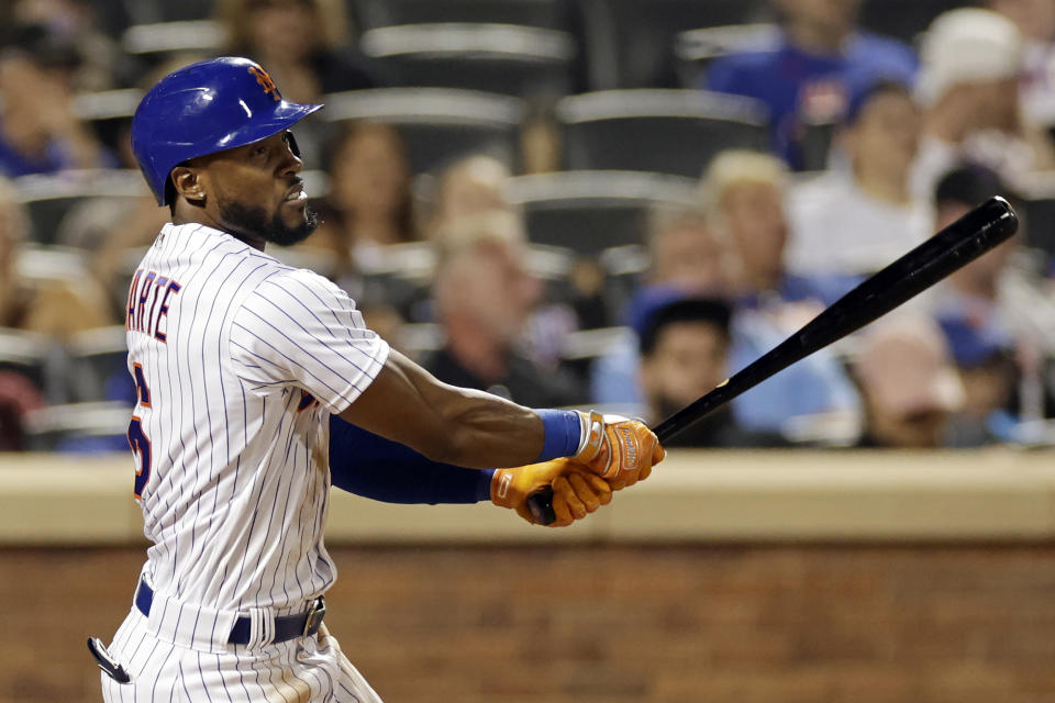 New York Mets' Starling Marte hits an RBI-double during the seventh inning of a baseball game against the Colorado Rockies on Saturday, Aug. 27, 2022, in New York. (AP Photo/Adam Hunger)