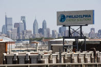 A sign for Philadelphia Energy Solutions stands at the refining complex in Philadelphia, Wednesday, June 26, 2019. The owner of the largest oil refinery complex on the East Coast is telling officials that it will close the facility after a fire last week set off explosions and damaged the facility. Philadelphia Mayor Jim Kenney said in a statement Wednesday that Philadelphia Energy Solutions had informed him of its decision to shut down the facility in the next month. The more than 1,000 workers there will be impacted, the mayor said. (AP Photo/Matt Rourke)