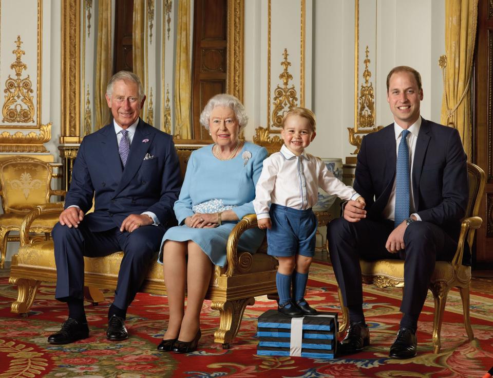 Prince Charles, Queen Elizabeth II, Prince George and Prince William pose for the Royal Mail in 2015 in the White Drawing Room at Buckingham Palace, released on April 20, 2016, to celebrate Queen Elizabeth's 90th birthday.