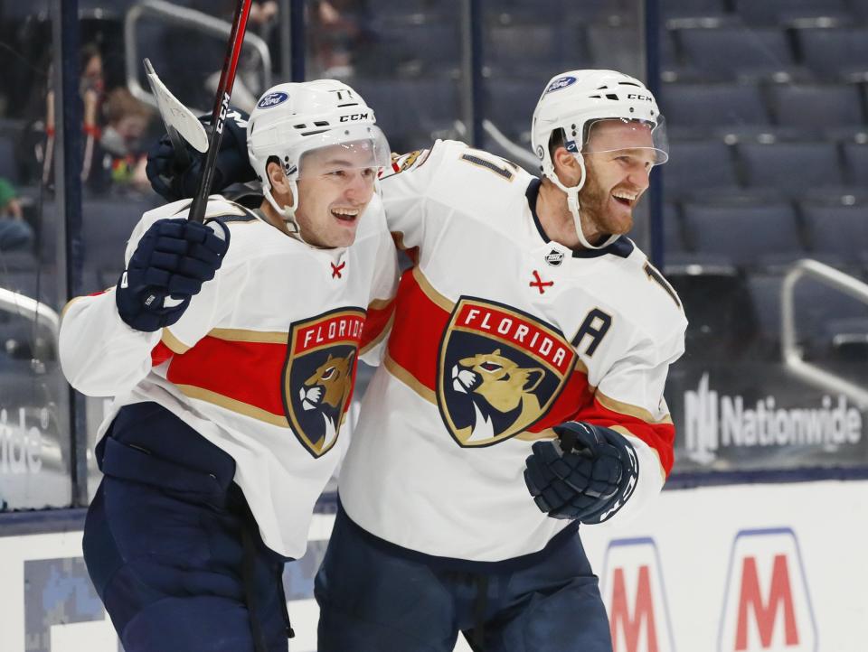 Entering Friday's game, Florida wing Jonathan Huberdeau, right,  was second in the NHL with 105 points.