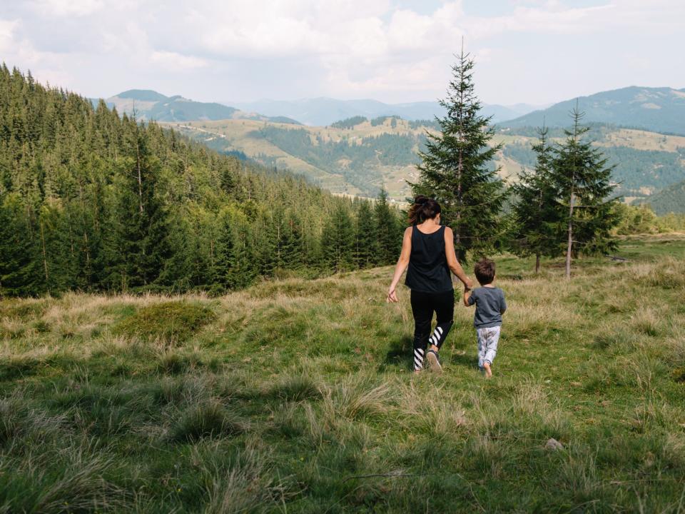 mother son hiking walking