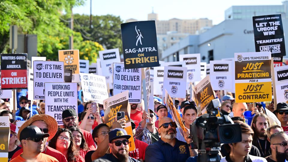 Members of the Writers Guild of America join UPS Teamsters during a rally ahead of a possible UPS strike on July 19, 2023, in Los Angeles. - Frederic J. Brown/AFP/Getty Images