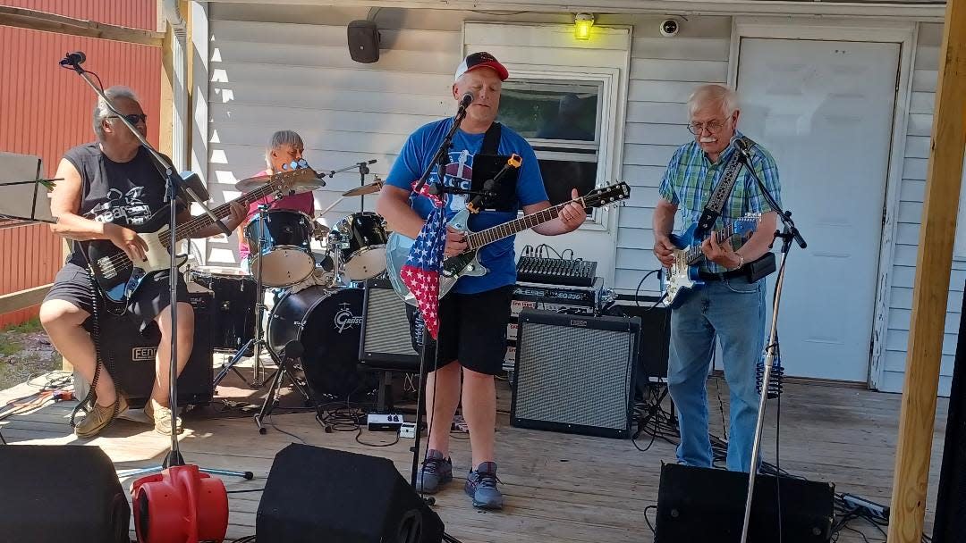 The Hearsay Band performs during the celebration of  The Water'n Hole's one-year anniversary June 18.