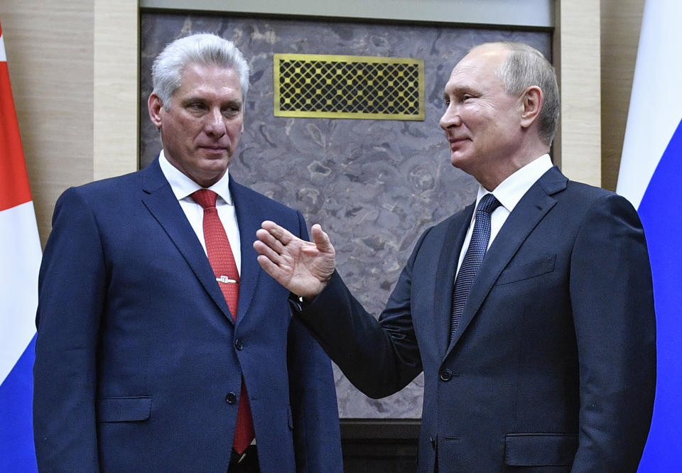 Russian President Vladimir Putin, right, and Cuban President Miguel Diaz-Canel attend their meeting at the Novo-Ogaryovo residence outside Moscow, Russia, Tuesday, Oct. 29, 2019. Putin hailed Cuba's resilience in the face of the U.S. pressure as he hosted Diaz-Canel for talks on expanding cooperation between the old allies. (Alexander Nemenov/Pool Photo via AP)