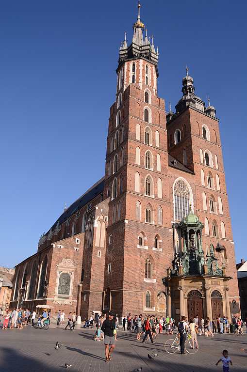 St Mary’s Church, Krakow, Poland Built in red brick with a wooden altar, the 14th century church rebuilt in Gothic style stands in the heart of Krakow and was built on the ruins of an earlier church, which was destroyed in a war. The church is characterised by two tall towers, a legend that refers to two brothers who built the church; one was murdered by the other due to jealousy. We wait near the Main Market Square to hear the trumpet played from atop the taller tower, a tradition that continues every day. The tradition, referred to as Hejnal Mariacki, is the playing of a Krakow anthem as a tribute to the 13th century bugler who was killed during a war when he tried to warn the people.