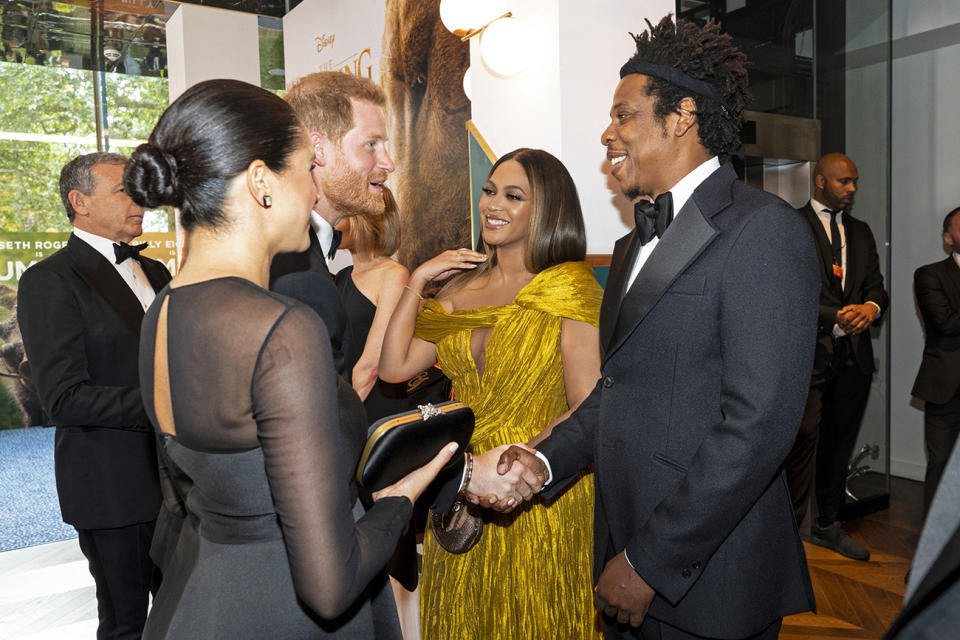 Britain's Prince Harry, Duke of Sussex (3rd L) and Britain's Meghan, Duchess of Sussex (2nd L) meet cast and crew, including US singer-songwriter Beyonc√© (C) and her husband, US rapper Jay-Z (R) as they attend the European premiere of the film The Lion King in London on July 14, 2019. (Photo by Niklas HALLE'N / POOL / AFP)        (Photo credit should read NIKLAS HALLE'N/AFP via Getty Images)