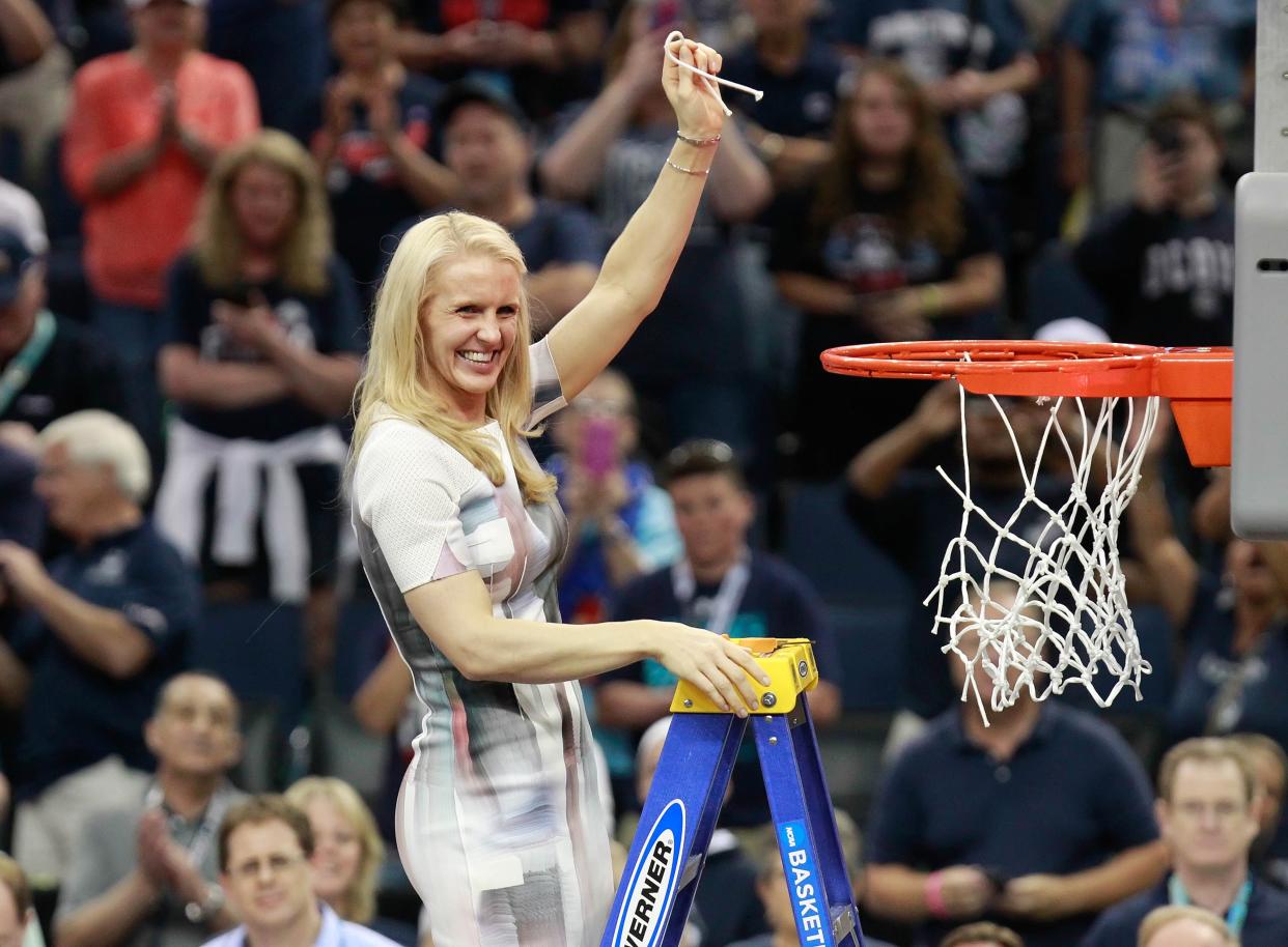 Connecticut assistant coach Shea Ralph cuts down the net after winning the 2015 championship game against Notre Dame.