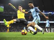 <p>Arsenal’s Hector Bellerin and Manchester City’s Raheem Sterling, right, battle for the ball during the English Premier League soccer match between Manchester City and Arsenal at the Etihad Stadium in Manchester, England, Sunday, Dec. 18, 2016. (AP Photo/Rui Vieira) </p>