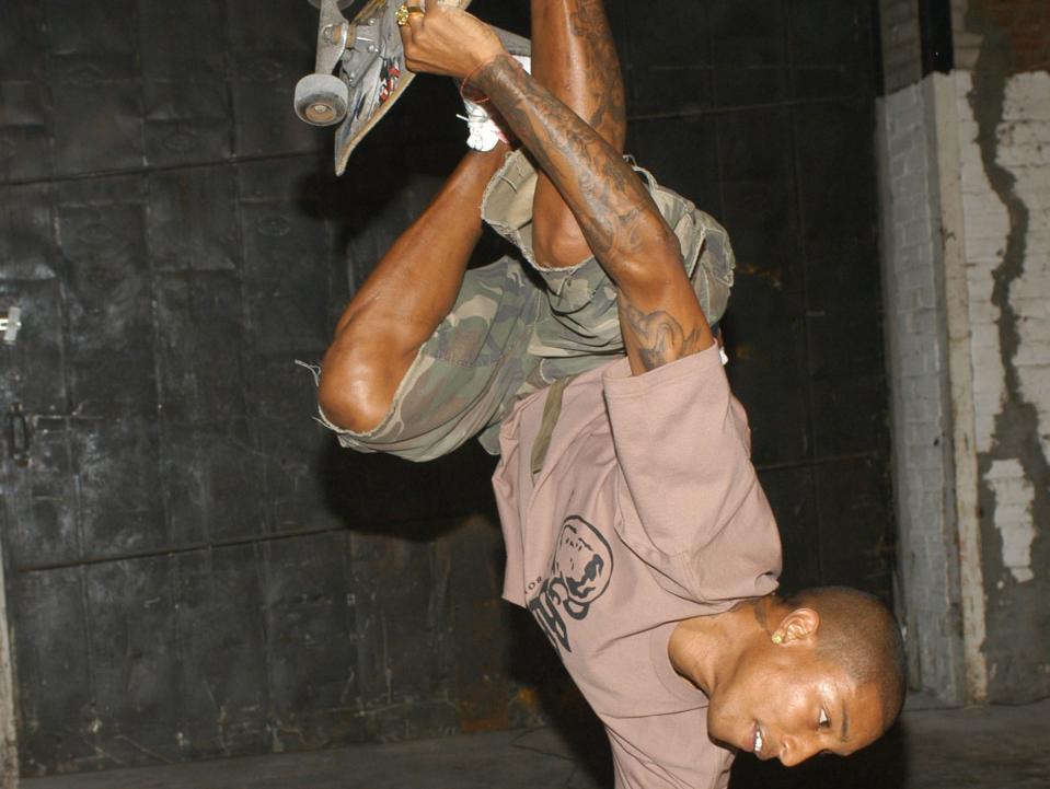 pharrell doing skateboard trick