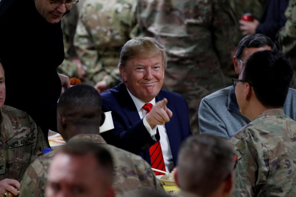 President Donald Trump eats dinner with U.S. troops at a Thanksgiving dinner event during a surprise visit at Bagram Air Base in Afghanistan, November 28, 2019. REUTERS/Tom Brenner