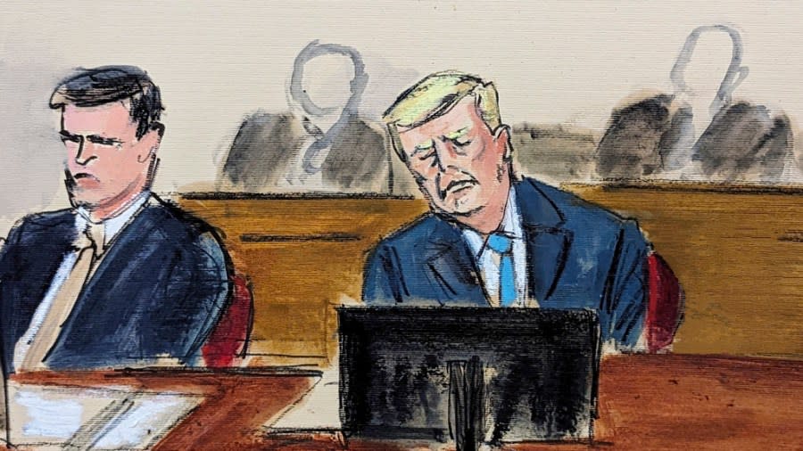 Donald Trump, right, sits at defense table during Judge Merchan’s reading of his ruling and instructions to the jury in Manhattan criminal court Monday, April 22, 2024, in New York. (Elizabeth Williams via AP)