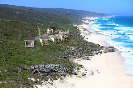 Uninterrupted views of a 6km deserted stretch of beach greet guests at this (Lekkerwater Beach Lodge)