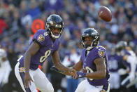 <p>Baltimore Ravens quarterback Lamar Jackson, left, and running back Kenneth Dixon chase after a loose ball in the first half of an NFL wild card playoff football game against the Los Angeles Chargers, Sunday, Jan. 6, 2019, in Baltimore. (AP Photo/Carolyn Kaster) </p>