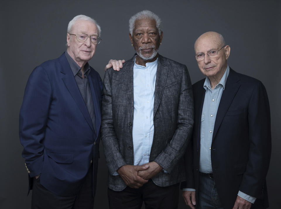 In this March 27, 2017 photo, actors Michael Caine, Morgan Freeman and Alan Arkin pose for a portrait to promote their new film "Going in Style" in New York. (Photo by Amy Sussman/Invision/AP)