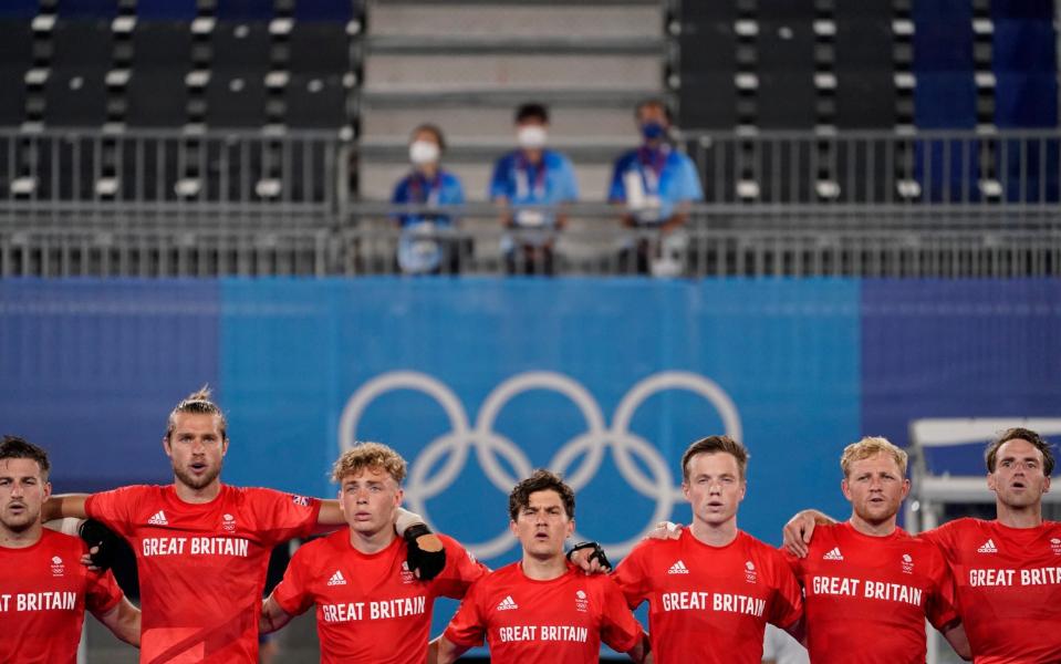 Great Britain line up for the national anthems - AP