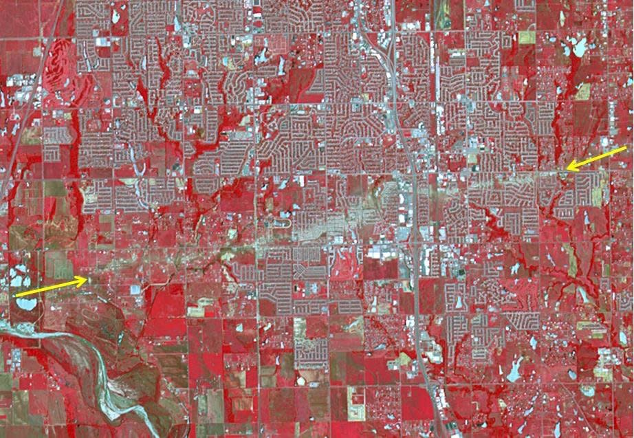 The Newcastle-Moore EF-5 tornado ripped through central Oklahoma on May 20, 2013, killing 24 people and leaving behind more than $2 billion in damage. On June 2, 2013, the Advanced Spaceborne Thermal Emission and Reflection Radiometer instrument on NASA's Terra spacecraft captured this image showing the scar left on the landscape by the tornado's deadly track. In this false-color image, vegetation is red, water is dark blue, roads and buildings are gray and white, and bare fields are tan. The tornado track crosses the image from left to right as indicated by the arrows. The image covers an area of 6 by 8.6 miles, and is located at 35.3 degrees north latitude, 97.5 degrees west longitude.