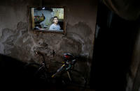 Palestinian cyclist Alaa Al-Daly, 21, who lost his leg by a bullet fired by Israeli troops, is seen inside the kitchen of his house in Rafah, southern Gaza Strip, April 18, 2018. REUTERS/Suhaib Salem