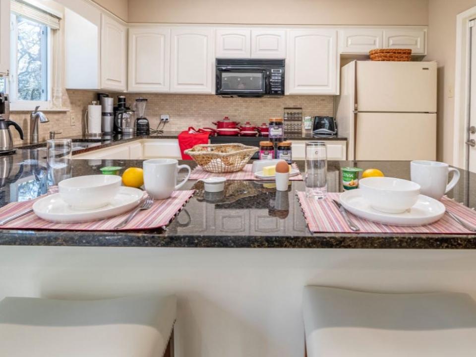 Kitchen table set for breakfast in Airbnb in Texas Hill Country Courtenay Rudzinski airbnb review