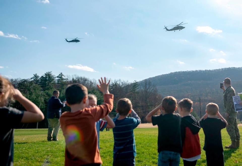 Bald Eagle Area students wave to the two Navy helicopters as they land at the school as part of the Veterans Day celebration on Thursday, Nov. 9, 2023. Abby Drey/adrey@centredaily.com