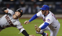 New York Mets first baseman Pete Alonso (20) tags out Arizona Diamondbacks' Tim Locastro (16) during the seventh inning of a baseball game Saturday, May 8, 2021, in New York. (AP Photo/Noah K. Murray)