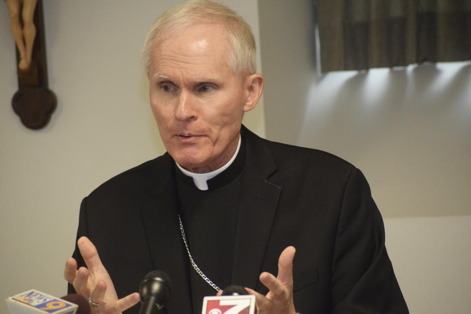 CORRECTS IDENTIFICATION TO MARK BRENNAN INSTEAD OF MICHAEL BRANSFIELD - Bishop Mark Brennan announces his appointment to serve as bishop of the Diocese of Wheeling-Charleston, during a news conference, Tuesday, July 23, 2019, in Wheeling, W.Va. Pope Francis named Brennan to lead West Virginia's Catholics following a scandal over the former bishop, Michael Bransfield, sexual harassment of adults and lavish spending of church money. (Scott McCloskey/The Intelligencer via AP)