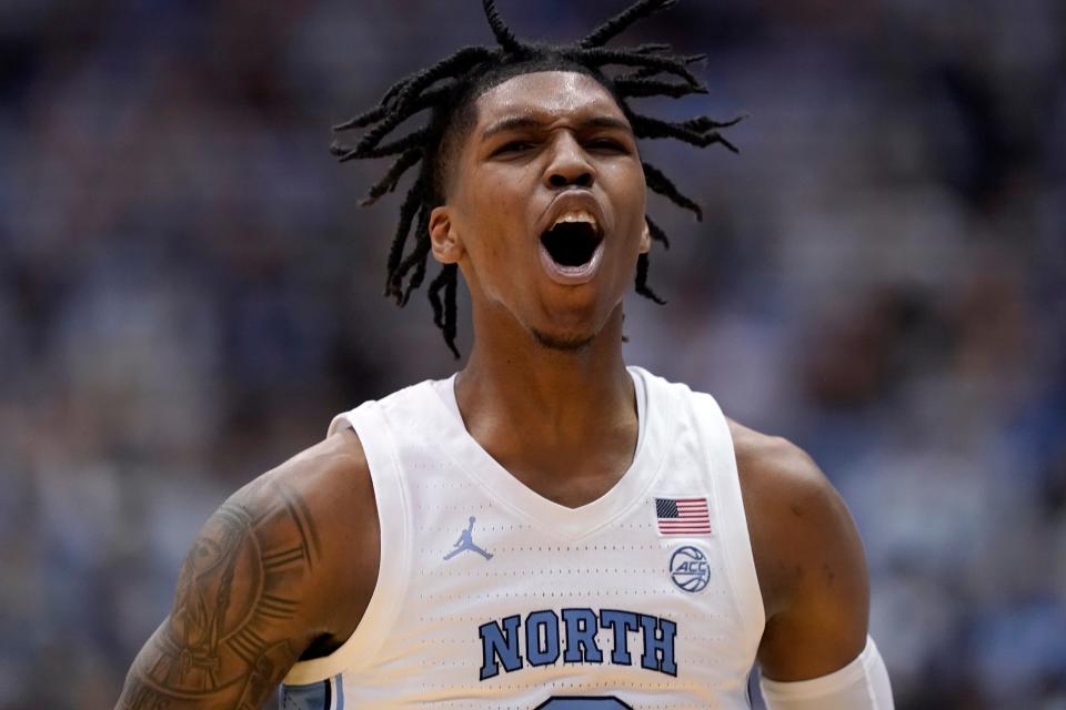 North Carolina guard Caleb Love (2) celebrates following a play against North Carolina State during the second half of an NCAA college basketball game in Chapel Hill, N.C., Saturday, Jan. 29, 2022.