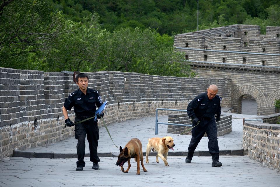 Two policeman patrol The Great Wall of China during a visit by US Secretary of State John Kerry and US Secreary of the Treasury Jacob Lew at Badaling, north of Beijing on July 8, 2014. US officials including Secretary of State John Kerry arrived in Beijing on July 8 for annual strategic and economic talks, with ties strained by differences over hacking and maritime tensions AFP PHOTO / WANG ZHAO        (Photo credit should read WANG ZHAO/AFP/Getty Images)