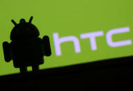 A 3D printed Android mascot Bugdroid is seen in front of an HTC logo in this illustration taken September 21, 2017. REUTERS/Dado Ruvic/Illustration